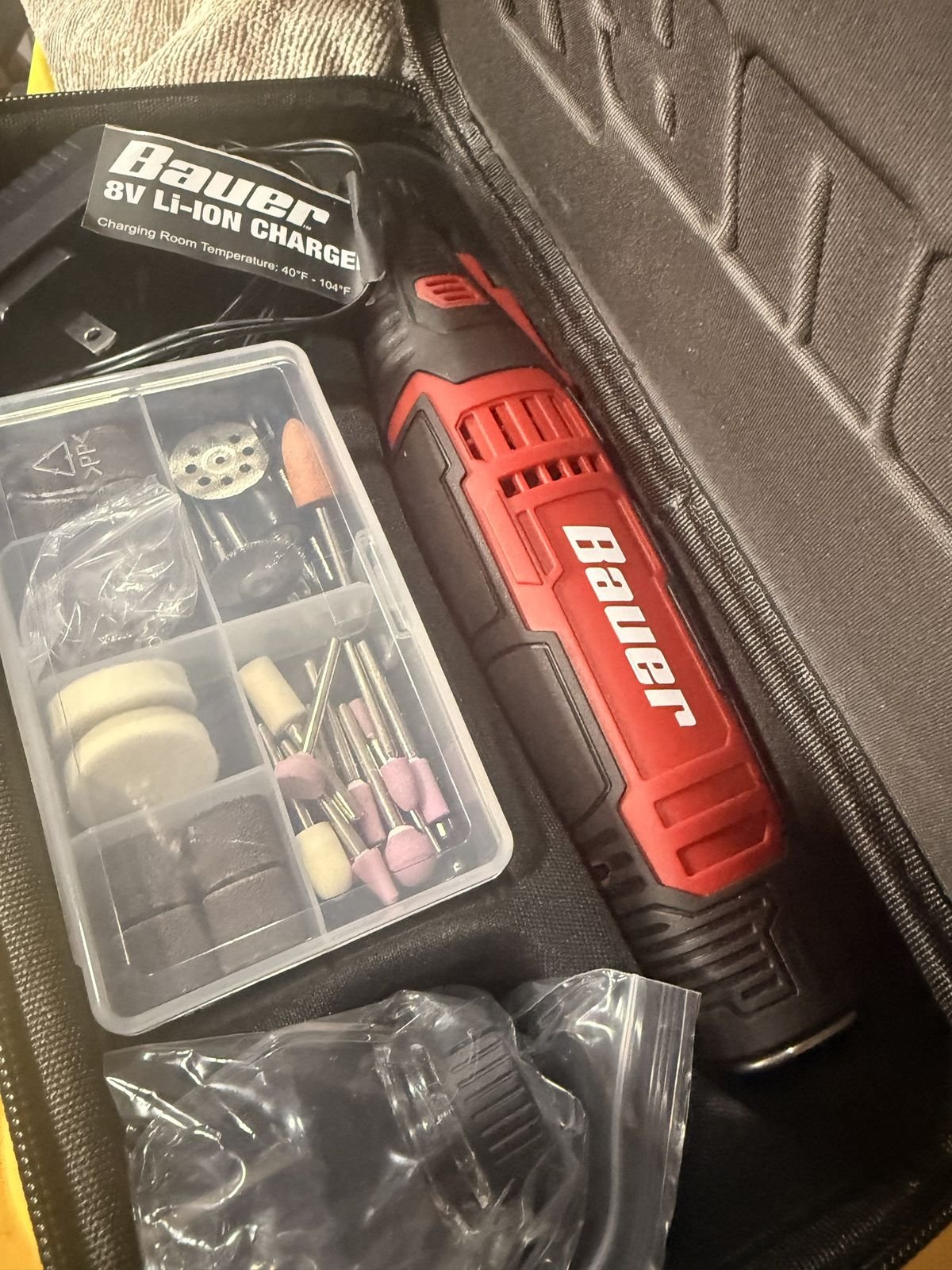 Cordless rotary tool kit with sanding bits used in the Redline repair shop