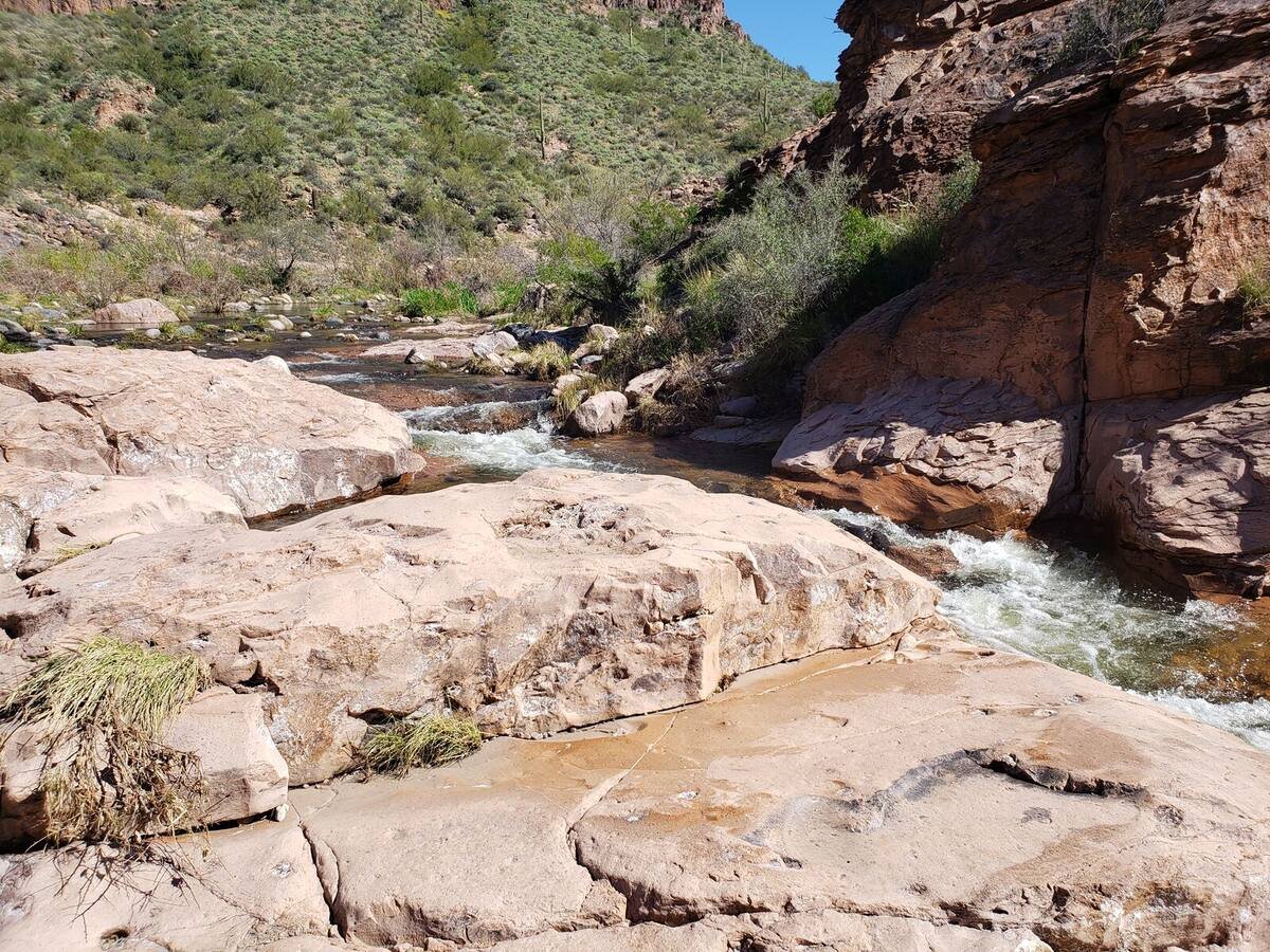 Water flowing over big rocks in the back of Canyon Lake near Boulder and La Barge Creek